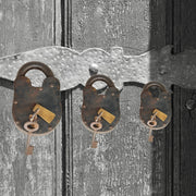 Vintage pad lock with 2 brass keys
Handcrafted iron lock for trunks
Old-fashioned padlock for doors
Rusted trunk lock with vintage keys
Decorative antique padlock India