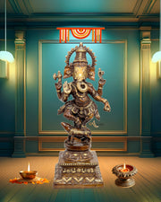 Decorative statue of a deity in a room with candles and decorative lights.