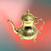 Gold-finish traditional brass teapot
Hand-engraved Moroccan style teapot
Peacock motif brass serving pot
Luxury brass teapot for home decor
Gold-finish brass teapot with handle
Traditional Moroccan peacock teapot