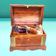 traditional wooden storage chest
brass inlay wooden box
handmade wooden decor box
antique style storage trunk
luxury wooden storage chest UAE
Rajasthani artisan wooden box