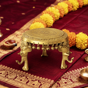  round brass pooja stand with ghungroo UAE, hand engraved brass round pooja stoo Sharjahl, brass embossed elephant leg pooja chowki Abu Dhabi, 