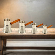 Silver plated brass Turkish coffee pot
Brass coffee warmer with rock design
Traditional Turkish cezve UAE
Hand-engraved coffee pot from India
Arabic coffee maker with wooden handle
Turkish coffee pot for hotels and cafes
Silver finish brass coffee server
Ornate brass Turkish tea pot
Coffee warmer pot handcrafted in India
Luxury Turkish coffee pot Al Athar