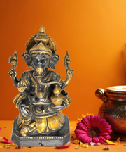 Black antique brass Ganesha idol holding kalash, 16 inches tall, 
handcrafted in India, 
available in Dubai