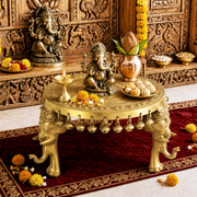 round brass pooja stand with 3 elephant legs, solid brass elephant leg pooja stool, 8 inch brass round bajot with elephant legs, antique brass round worship stand, 