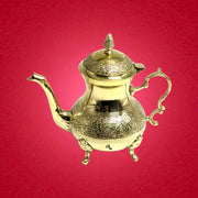 Moroccan-style brass teapot
Gold-finish Peacock teapot
Hand-engraved brass serving pot
Traditional Peacock design teapot
Decorative Peacock motif teapot
Brass teapot for rich serving
Gold-plated Moroccan teapot