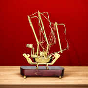 handmade brass boat home decor, handcrafted brass sailboat sculpture, decorative brass sailing ship, brass boat model with wooden base, polished brass boat showpiece, 