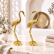 brass wildlife sculptures, majestic crane bird pair, brass crane birds UAE, golden crane pair Dubai, brass heron statues Sharjah, decorative crane birds Abu Dhabi, brass egret pair Ajman, 