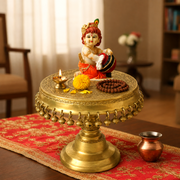  brass embossed round pooja chowki, hand engraved brass worship platform, intricate brass engraving pooja chowki, artisan engraved brass pooja stool, 
