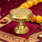 elegant round brass pooja stool, designer brass pooja chowki, artistic brass round bajot, decorative brass worship stand, royal style brass pooja chowki, 