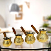 Brass Turkish coffee pot with wooden handle
Traditional cezve for Arabic coffee
Hand-engraved brass coffee maker
Gold-finish Turkish coffee pot
Durable brass pot for brewing
Small turkish pot with wood grip
Cezve for rich Turkish coffee
Authentic Arabic coffee pot
Traditional brass brewing tool
Coffee serving pot with handle