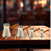 Silver plated Turkish coffee cezve
Brass coffee pot for traditional brewing
Etched brass coffee warmer for Arabic gahwa
Elegant Turkish coffee pot with rock texture
Handcrafted coffee pot with silver accents
Middle Eastern coffee pot for gifting
Durable brass pot for Turkish coffee
Rock pattern Turkish cezve with long handle
Sharjah UAE brass coffee ware