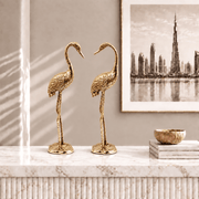  brass stork birds, golden stork pair, brass flamingo pair, golden flamingo statues, wading bird sculptures, water bird figurines, wetland bird statues, coastal bird sculptures, oriental crane figurines, 
